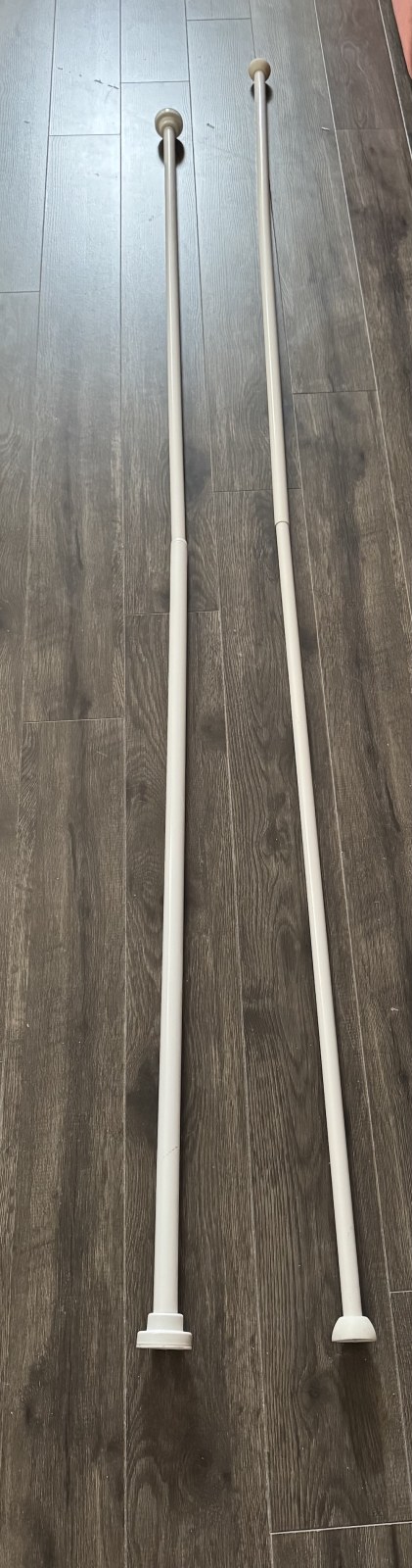 2 white extendable rods for your shower curtain